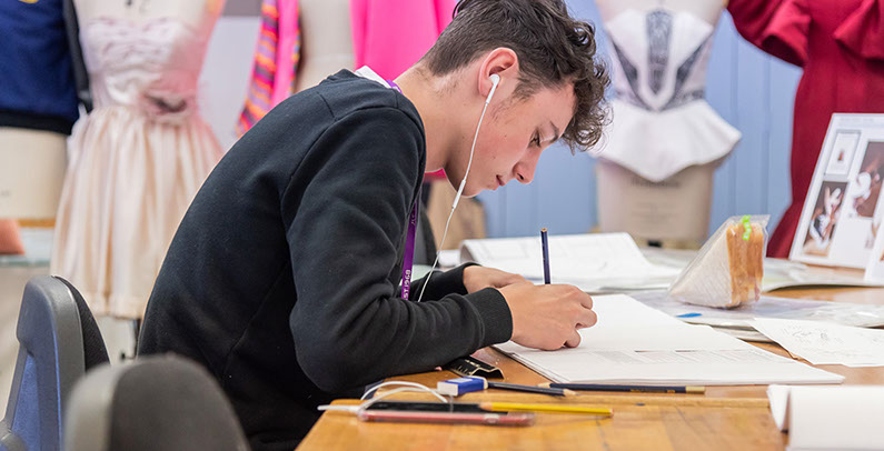 School Commercial Photography of Teenage Boy Drawing.